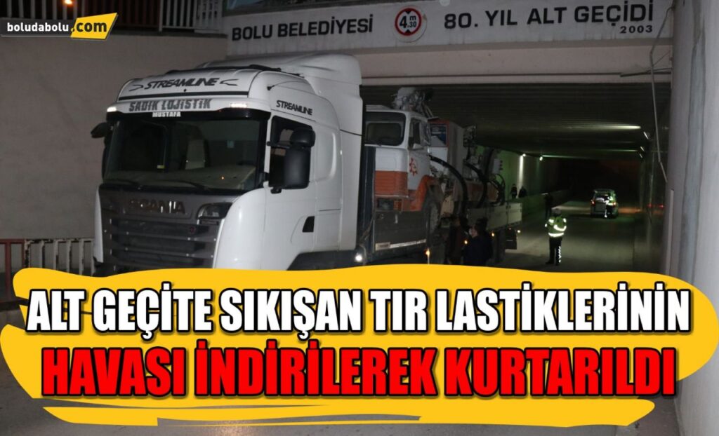 Bolu’da alt geçide sıkışan tır lastiklerinin havası indirilerek kurtarıldı Bolu’da alt geçide sıkışan tır lastiklerinin havası indirilerek kurtarıldı